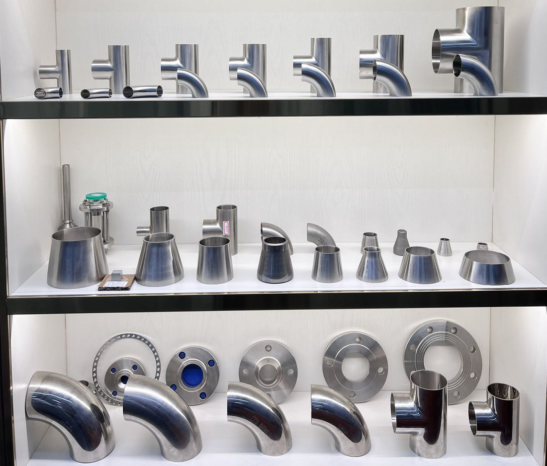 Shelf display of nickel alloy tees, reducers, elbows and flanges